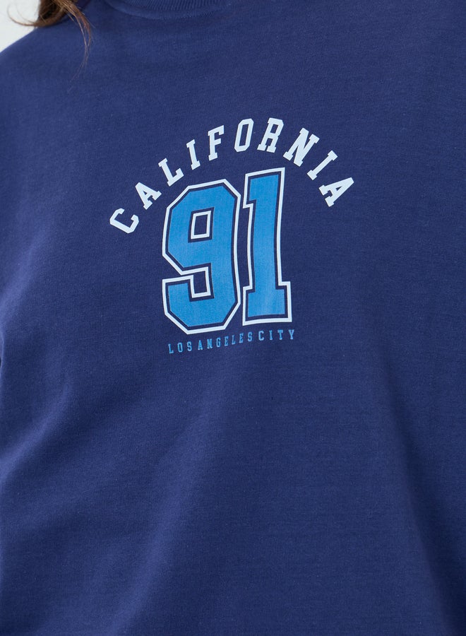 ستايلي طقم منسق من بنطال بأرجل واسعة وسويت شيرت بطبعة جرافيك - Image 2